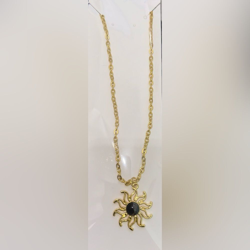 Elegant Gold Sunburst Necklace with Black Accent